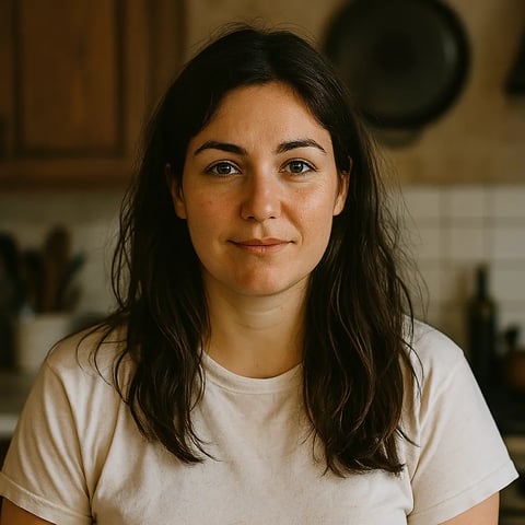 A woman with long hair and a white shirt.