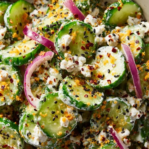 A bowl of jalapeno popper cucumber salad.