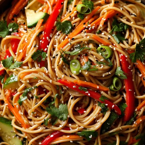 A bowl of cold sesame noodle salad.